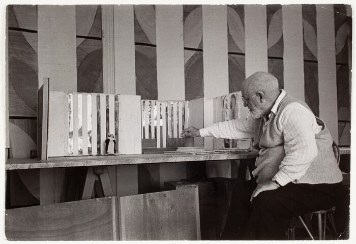 Henri Matisse working on the model